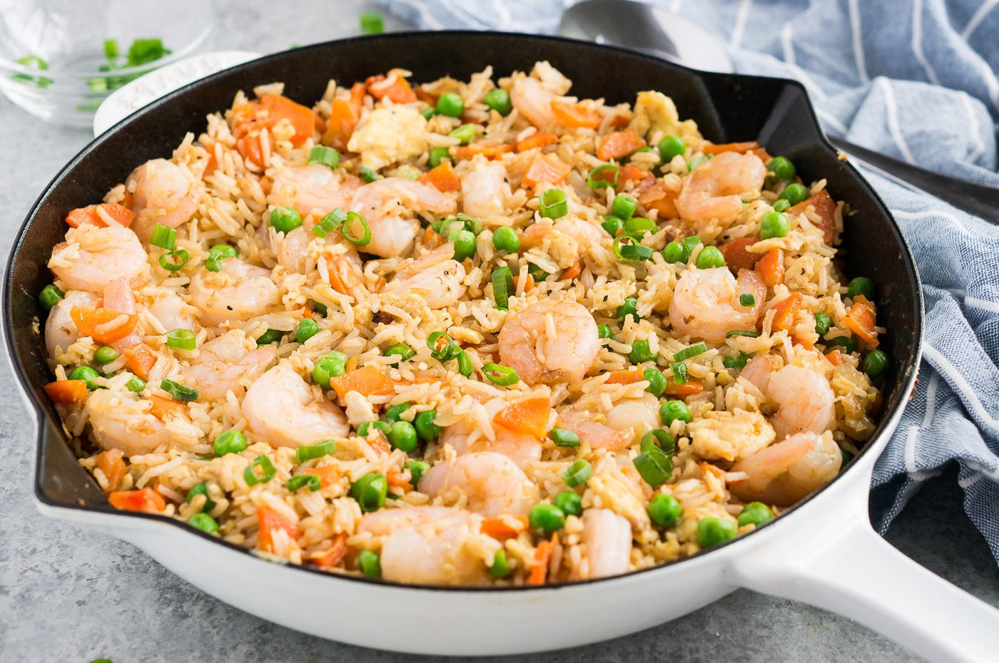 shrimp fried rice in a white skillet
