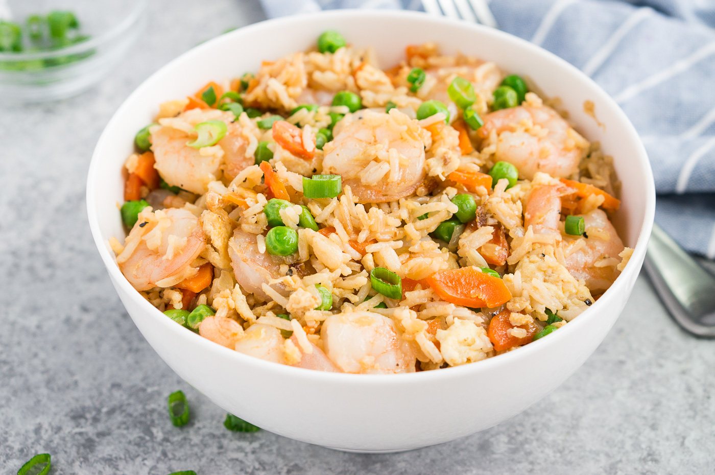 shrimp with fried rice in a white bowl