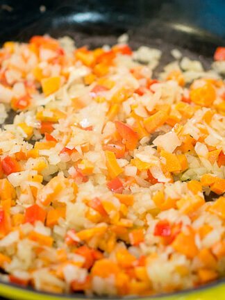 sauteeing vegetables in a skillet
