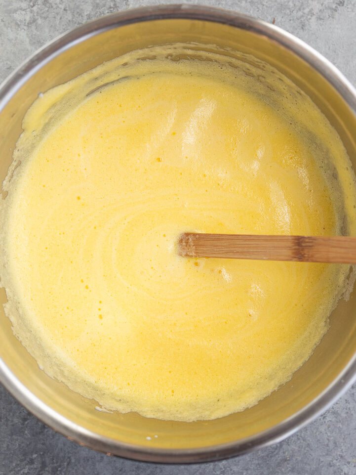 making moussaka topping with yogurt eggs and cheese