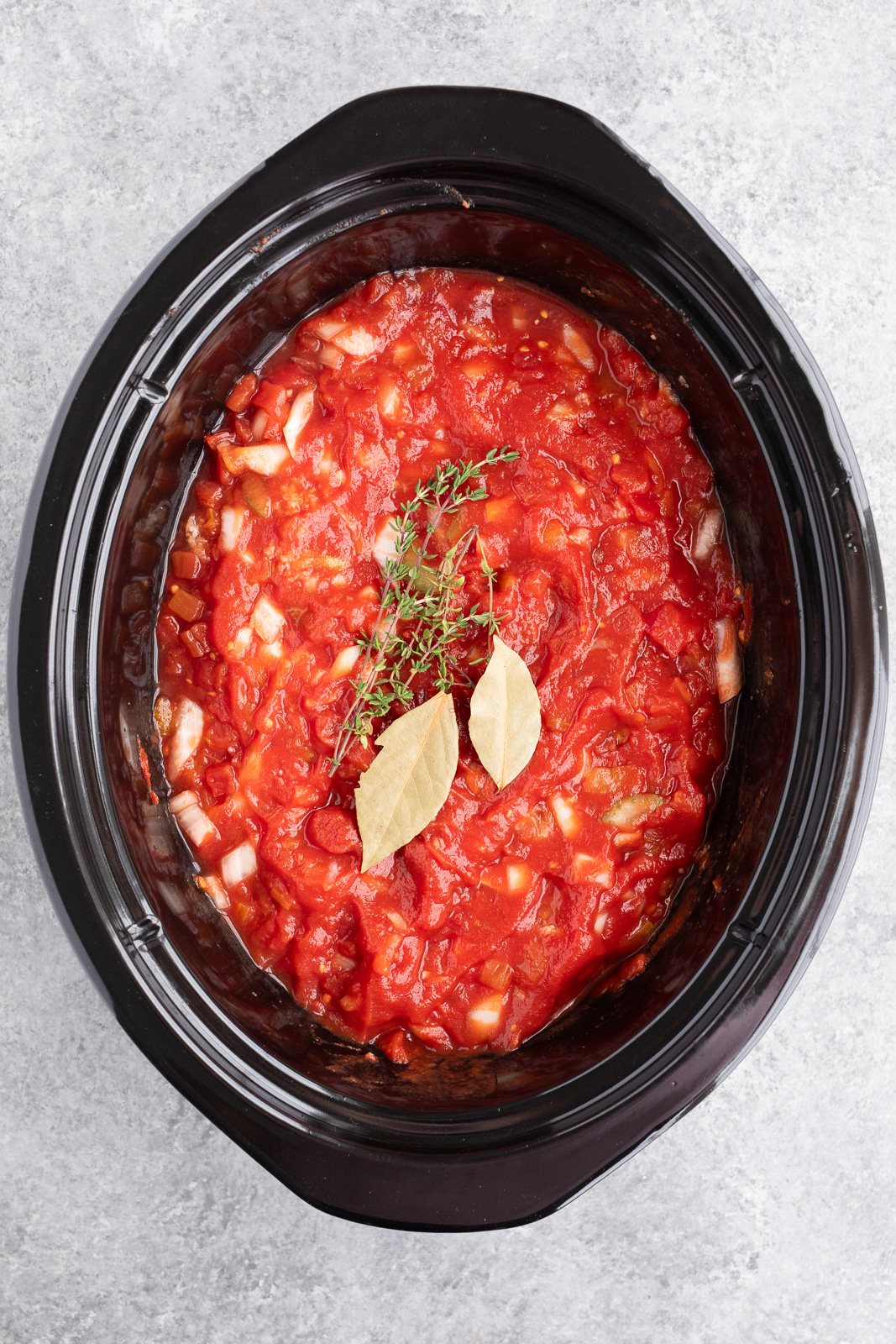 making ragu sauce in the slow cooker