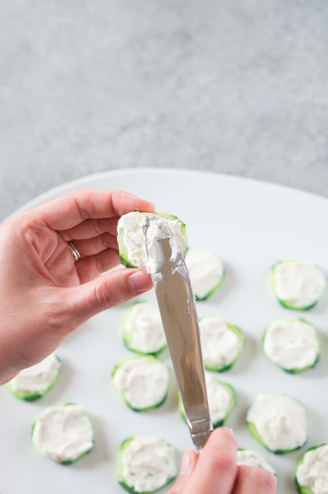cream cheese on cucumber slices