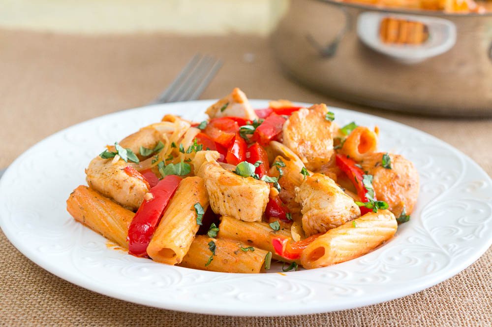 Chicken Riggies on a white patterned plate next to a fork