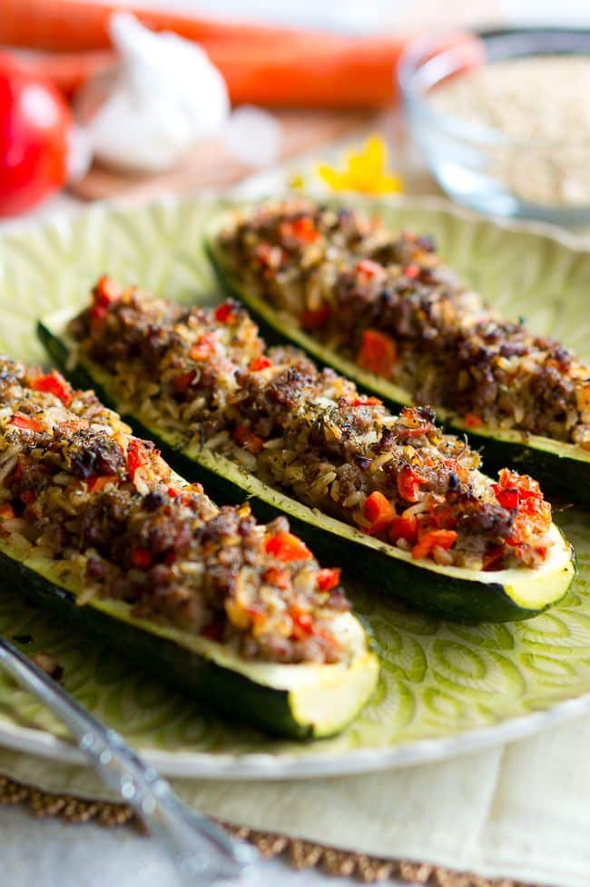Three Stuffed Zucchini Boats on a plate ready to serve