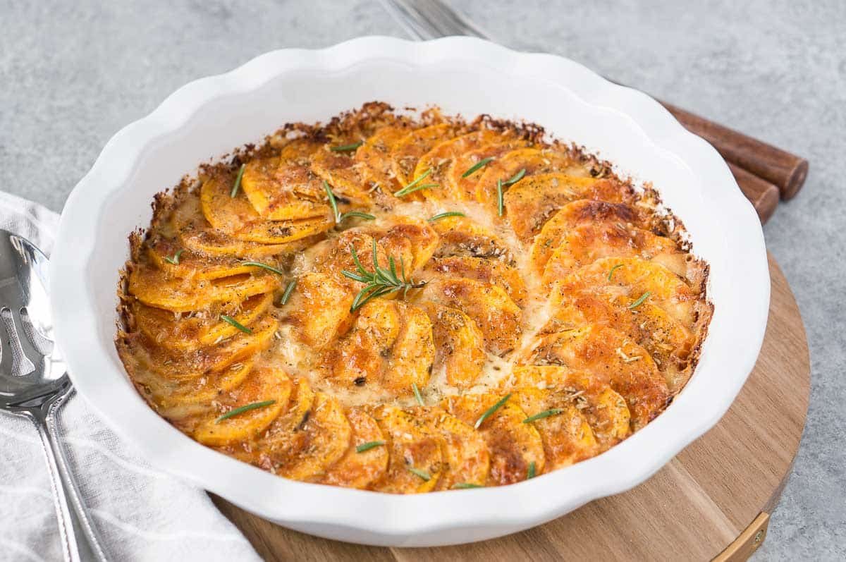 creamy sweet potato bake for thanksgiving in a white dish