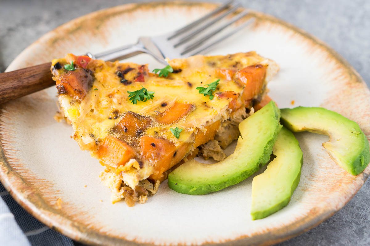 a slice of turkey and sweet potato frittata on a plate