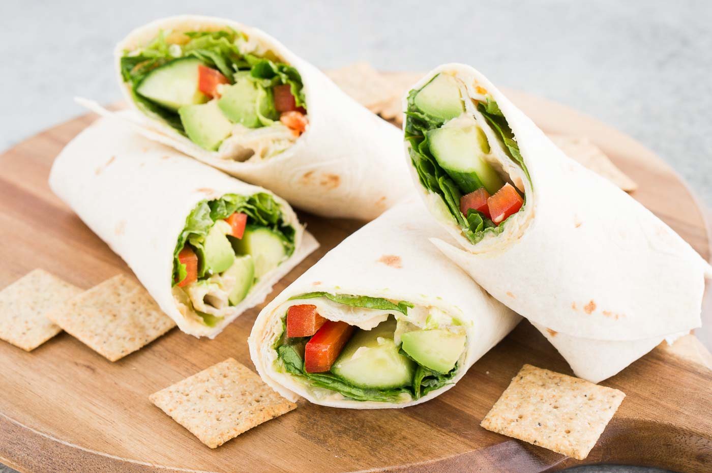 vegetarian wrap and crackers on a board