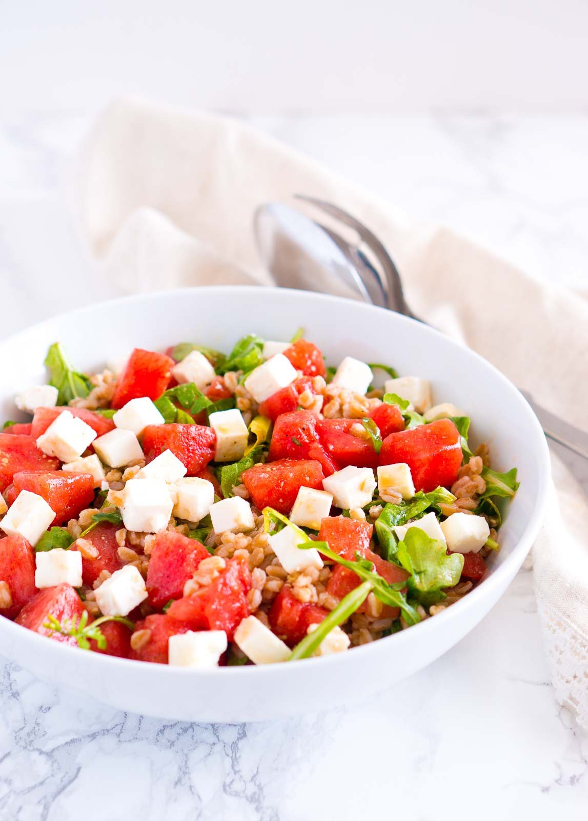 Watermelon Feta Salad served in a bowl next to a spoon