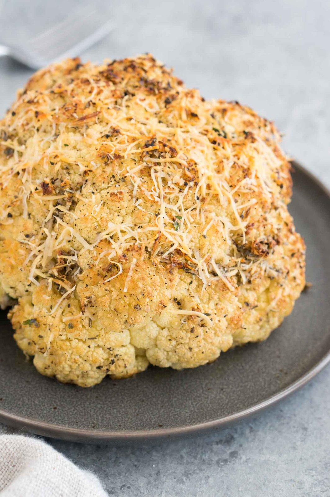 whole roasted cauliflower on a plate
