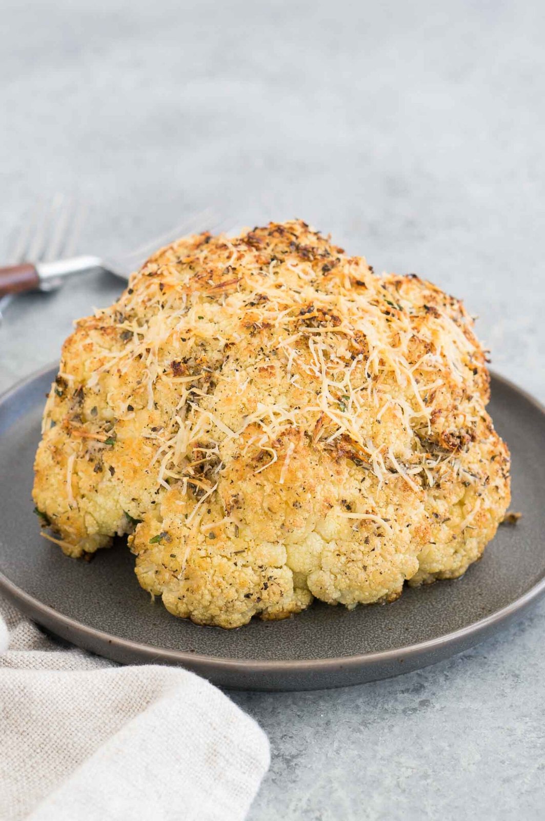 oven roasted whole cauliflower on a plate