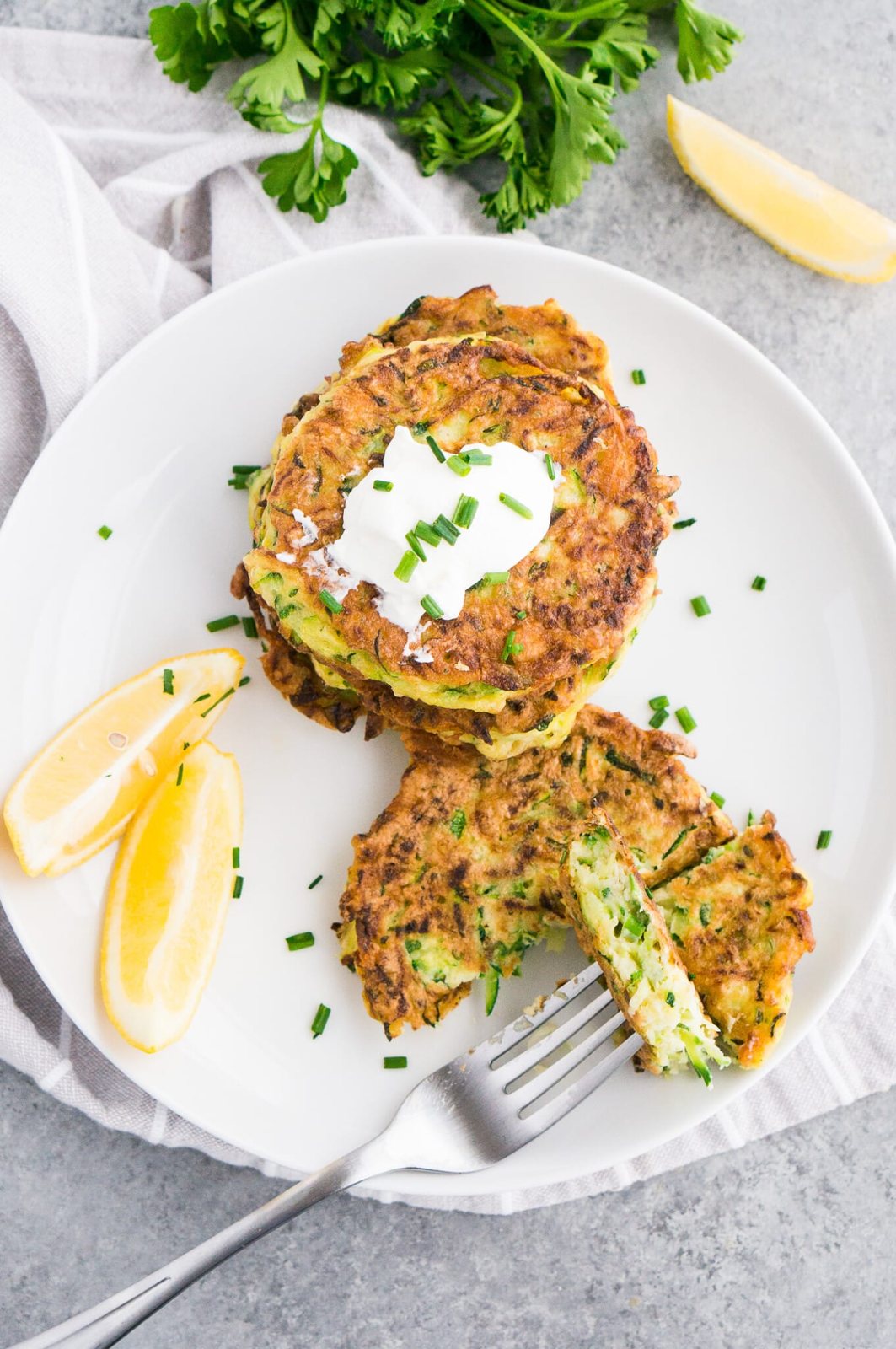 sliced zucchini fritters on a plate