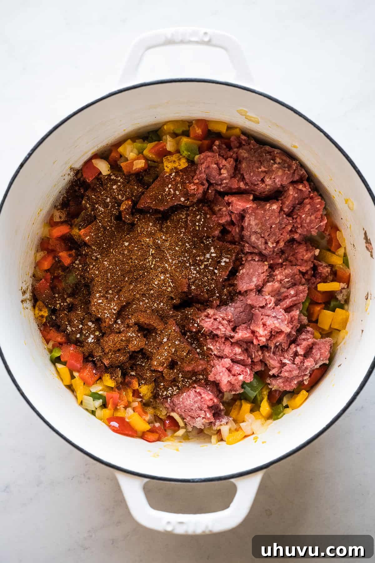 Browning ground beef with a blend of taco seasonings in a pot for taco soup.