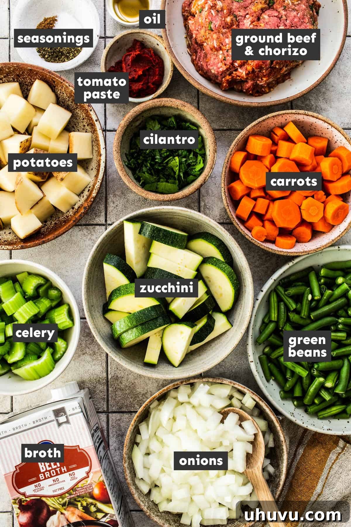 Prepped and chopped ingredients for albondigas soup on a table.