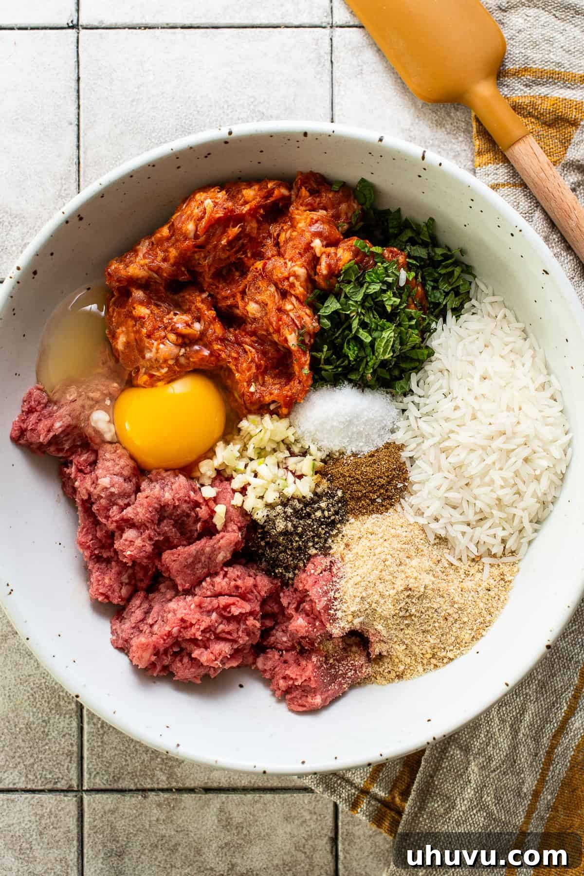 All the ingredients for albondigas (aka Mexican meatballs) in a bowl.