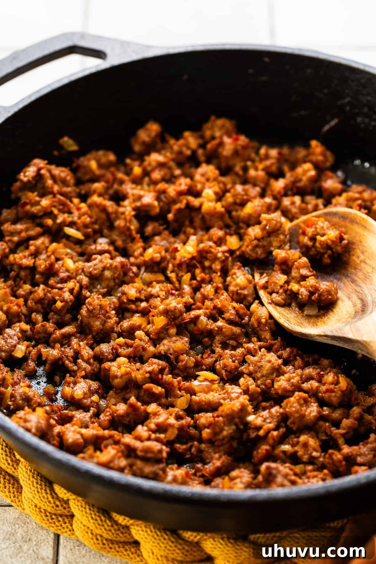 Fiery Chorizo Morning 5 Mexican pork chorizo, crumbled and perfectly cooked, sizzling in a skillet with its rendered fat, alongside softened vegetables.
