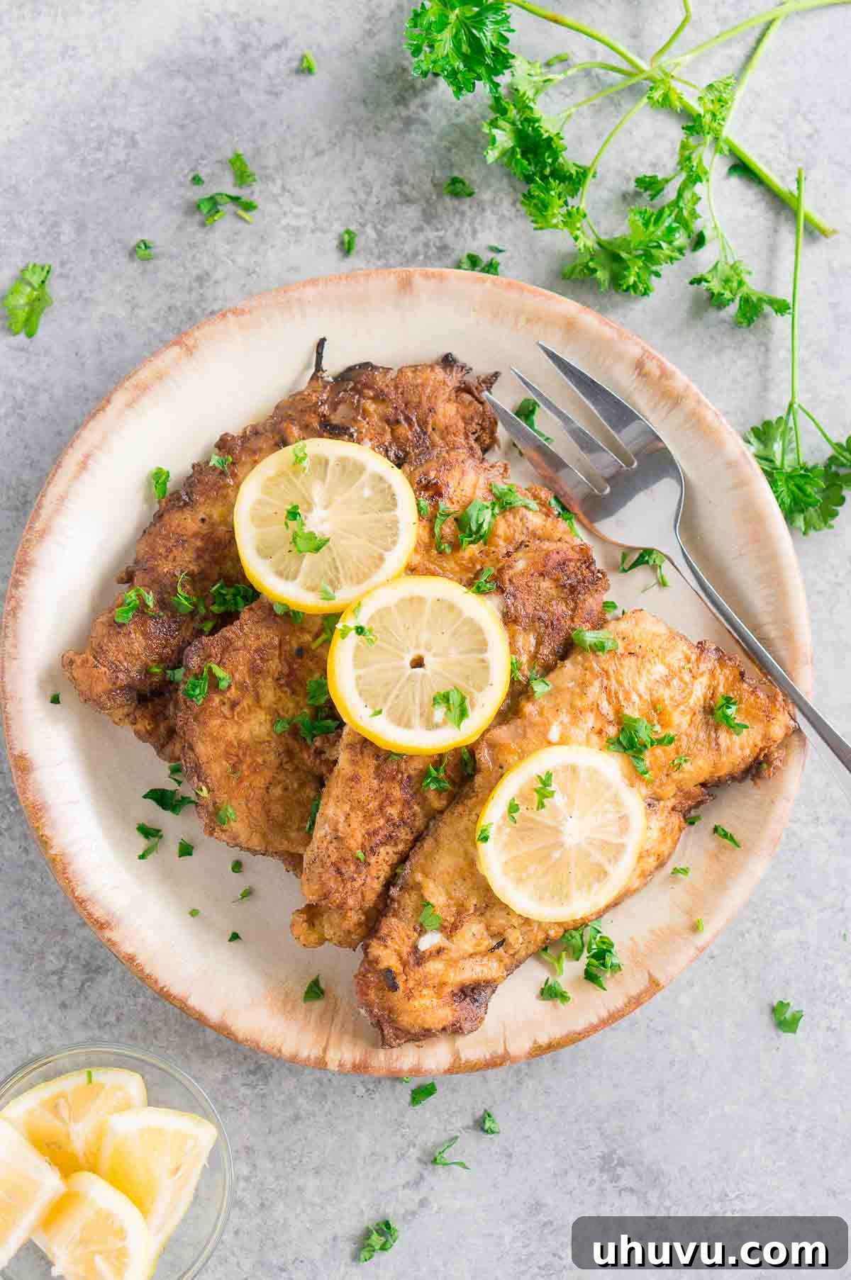 Chicken Francese with a rich, creamy lemon butter sauce, ready to be served.