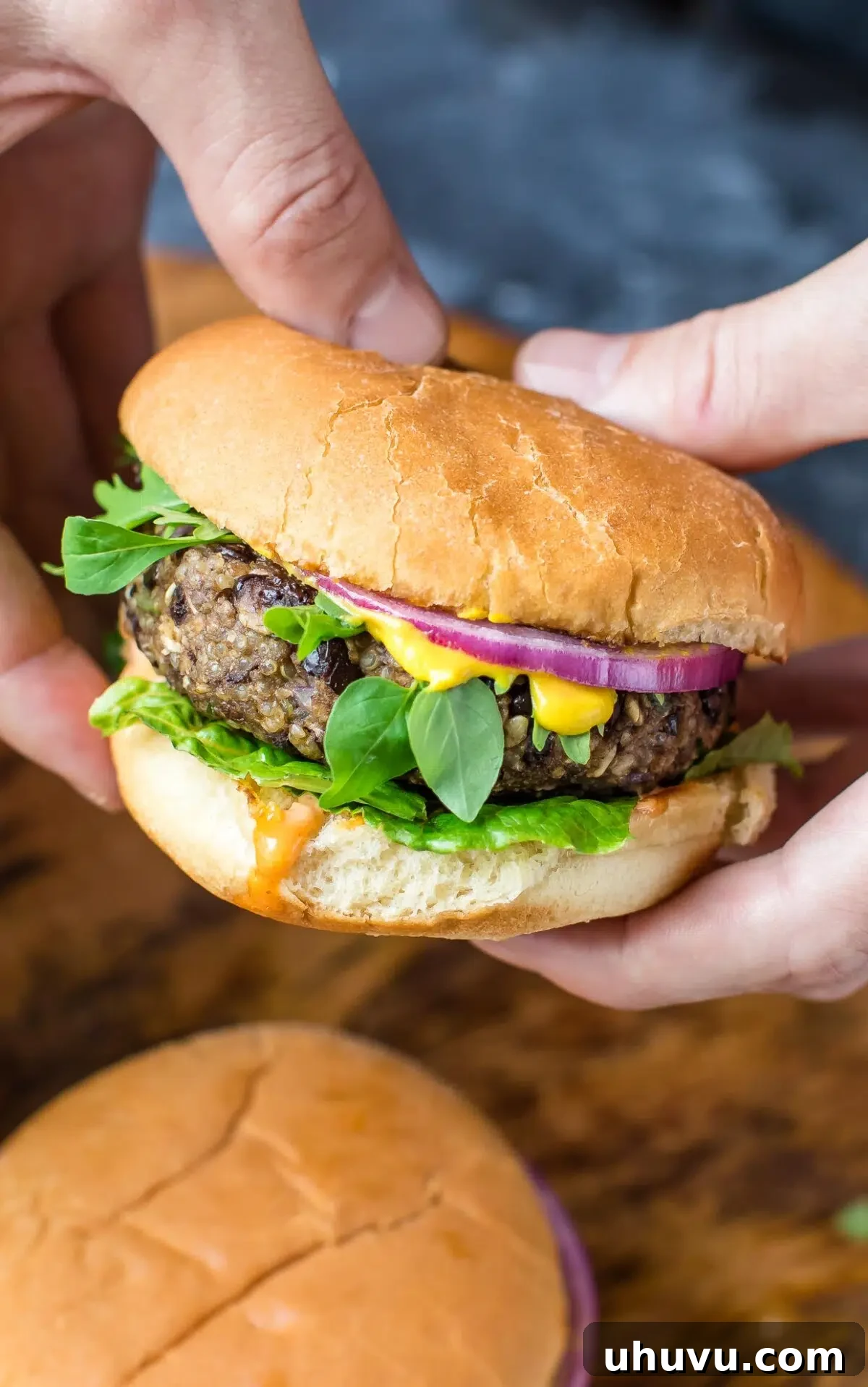 Quick Freezer Meals: Recipes and Time-Saving Hacks 23 A close-up of a homemade Quinoa Black Bean Veggie Burger, appetizing and healthy.