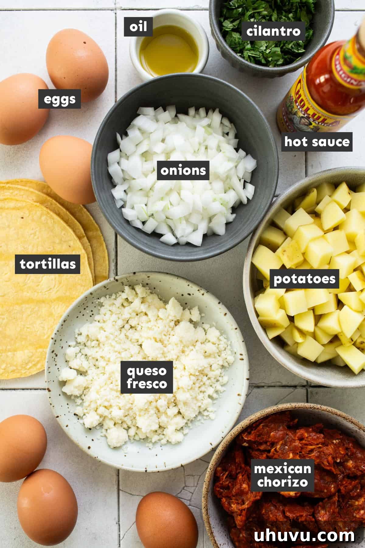 Morning Taco Bliss 3 Ingredients for breakfast tacos laid out on a table, including eggs, potatoes, onions, chorizo, and tortillas.