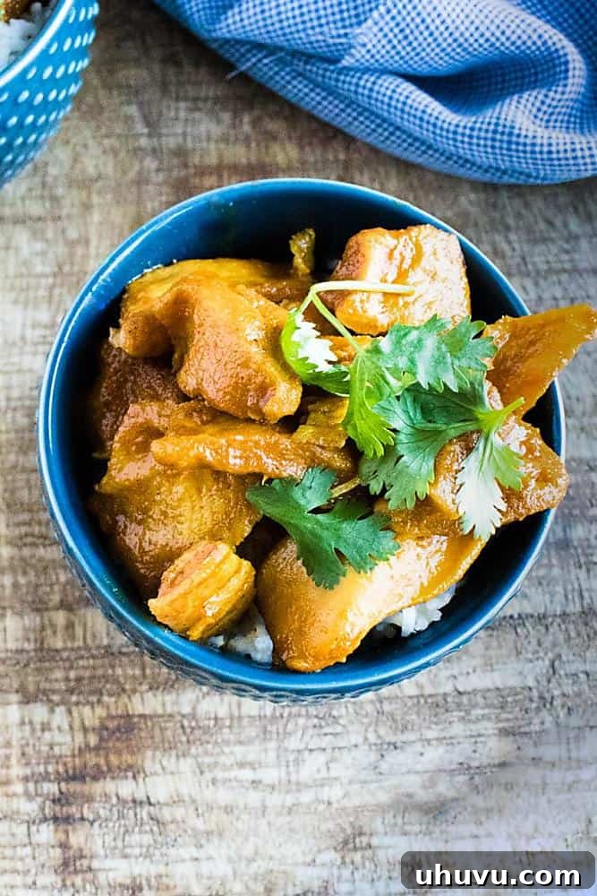Creamy chicken curry made in an Instant Pot, served in a vibrant blue bowl