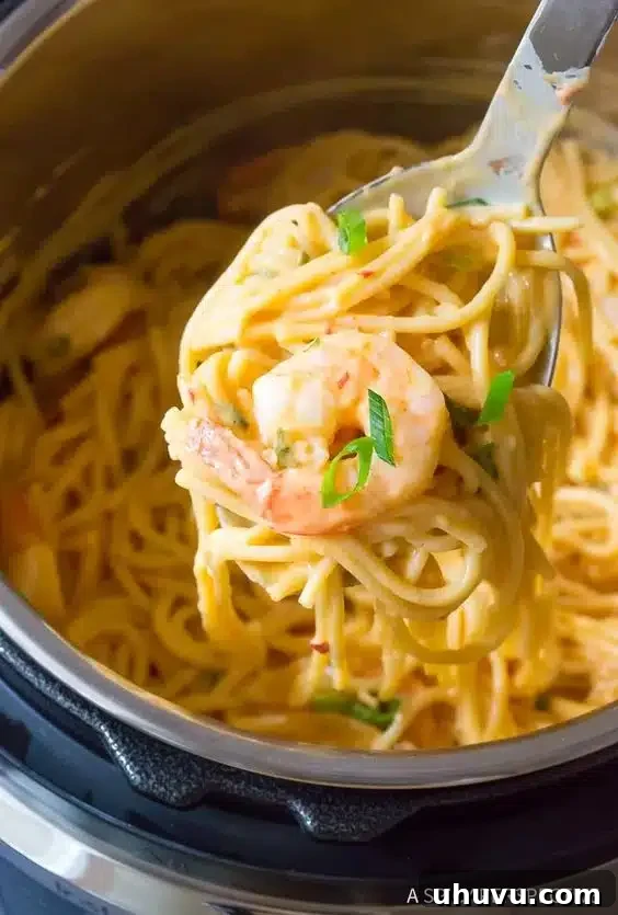 Easy Instant Pot recipe: Bang Bang shrimp served over spaghetti noodles with a creamy sauce