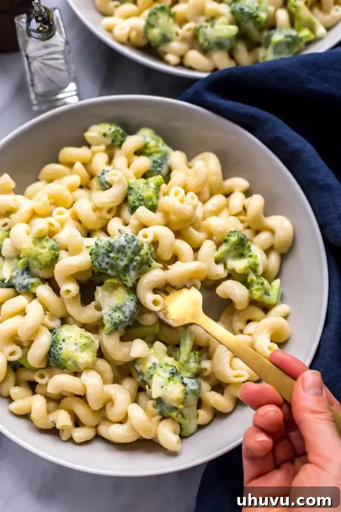 Creamy Instant Pot mac and cheese with fresh broccoli florets mixed in