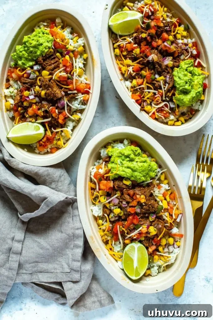 Three bowls of flavorful Barbacoa beef with various taco toppings like cilantro and lime