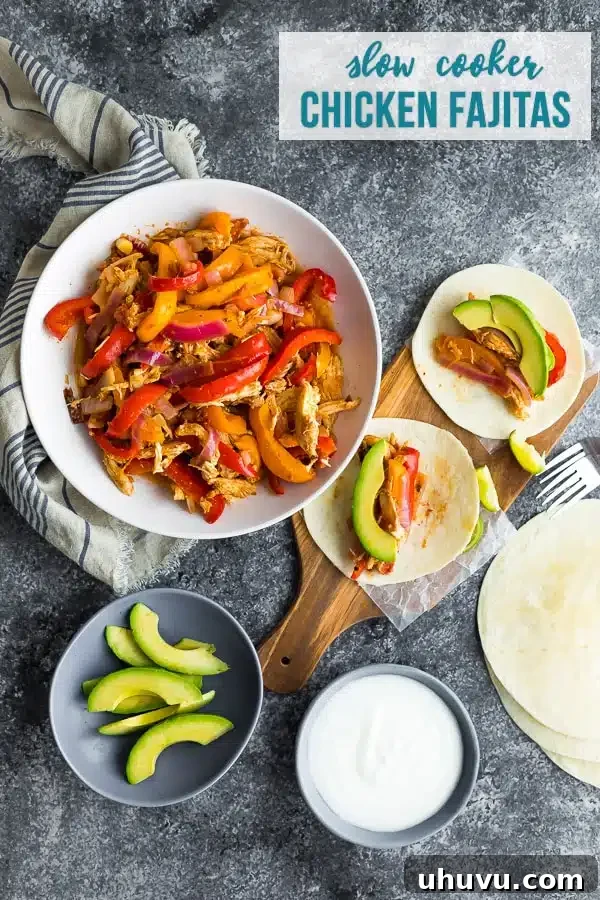 A plate with vibrant slow cooker chicken fajitas, bell peppers, and onions