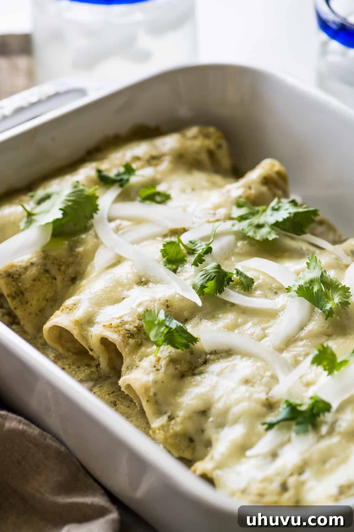Creamy Tomatillo Enchiladas 8 Enchiladas suizas in a baking dish.