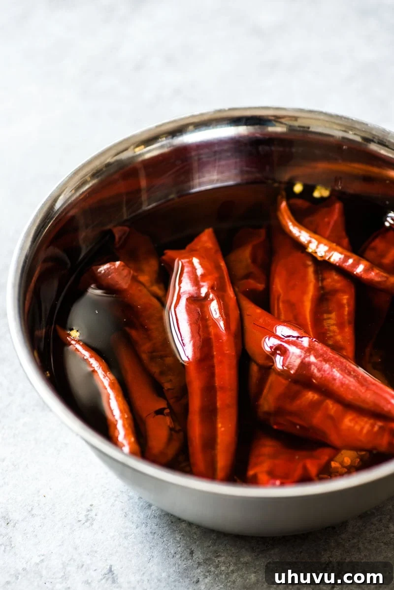 Guajillo peppers and chile de arbol peppers soaking for Camarones a la Diabla.