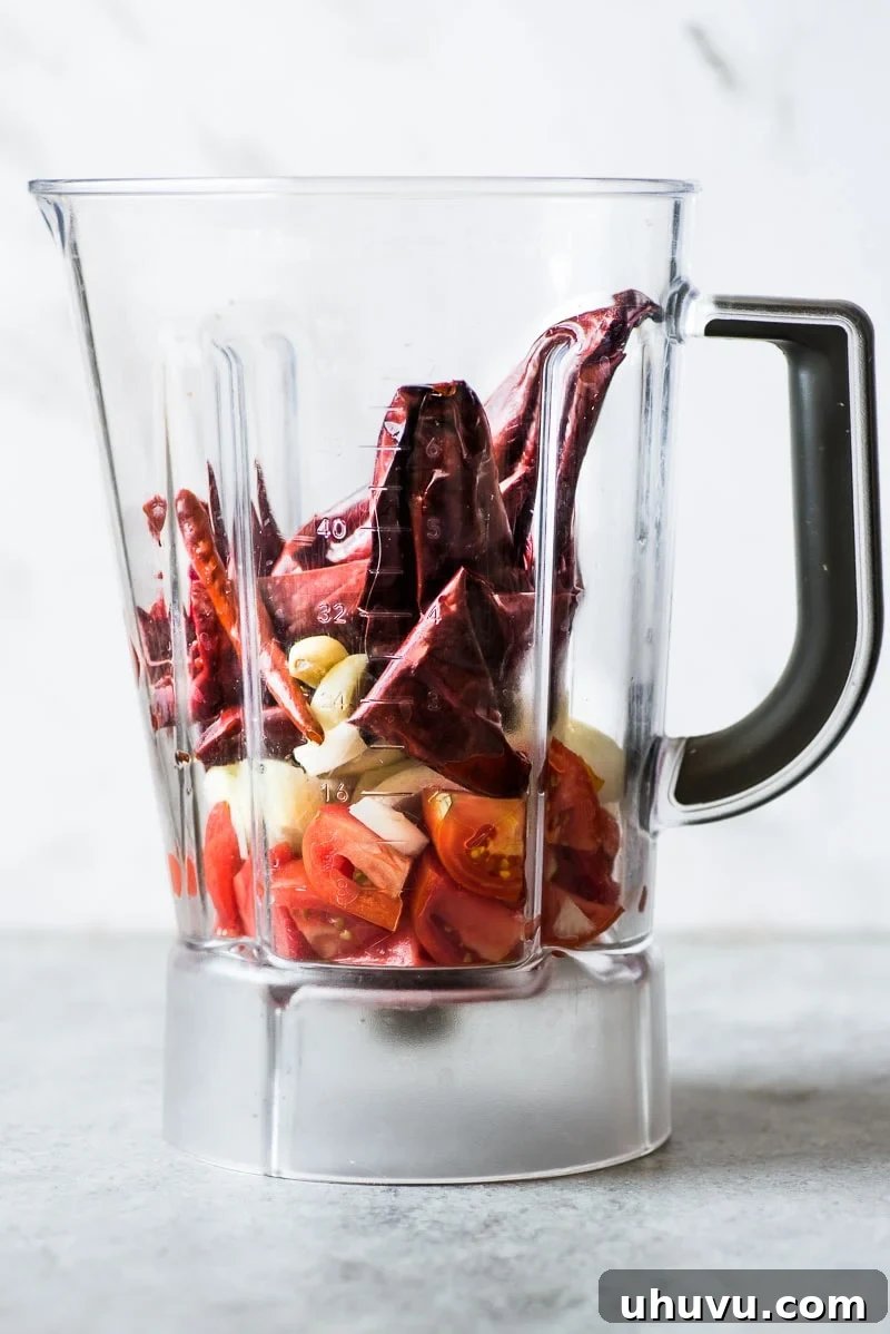 Guajillo peppers and chile de arbol in a blender for Camarones a la Diabla.