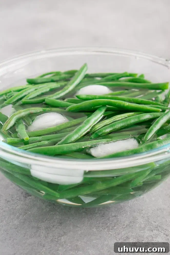 Blanched green beans in an ice bath