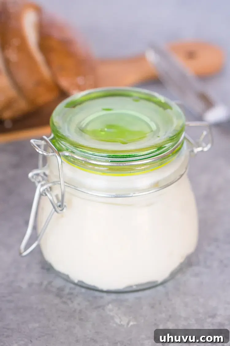 Homemade butter stored in a glass jar in the fridge