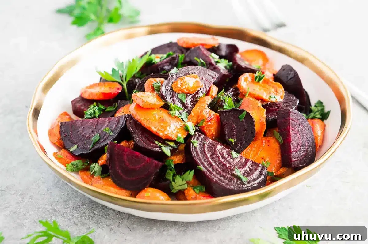 Honey Glazed Root Medley 3 beets and carrots in a bowl on a gray board