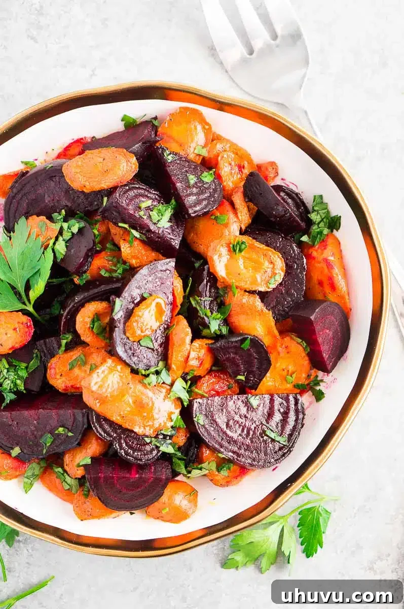 roasted beets and carrots - thanksgiving side dish served in a white bowl