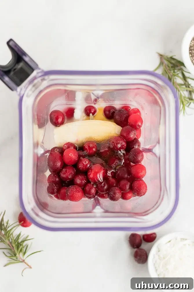 Smoothie ingredients being added to the blender