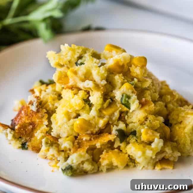 Green Chili Corn Casserole on a plate ready to eat.