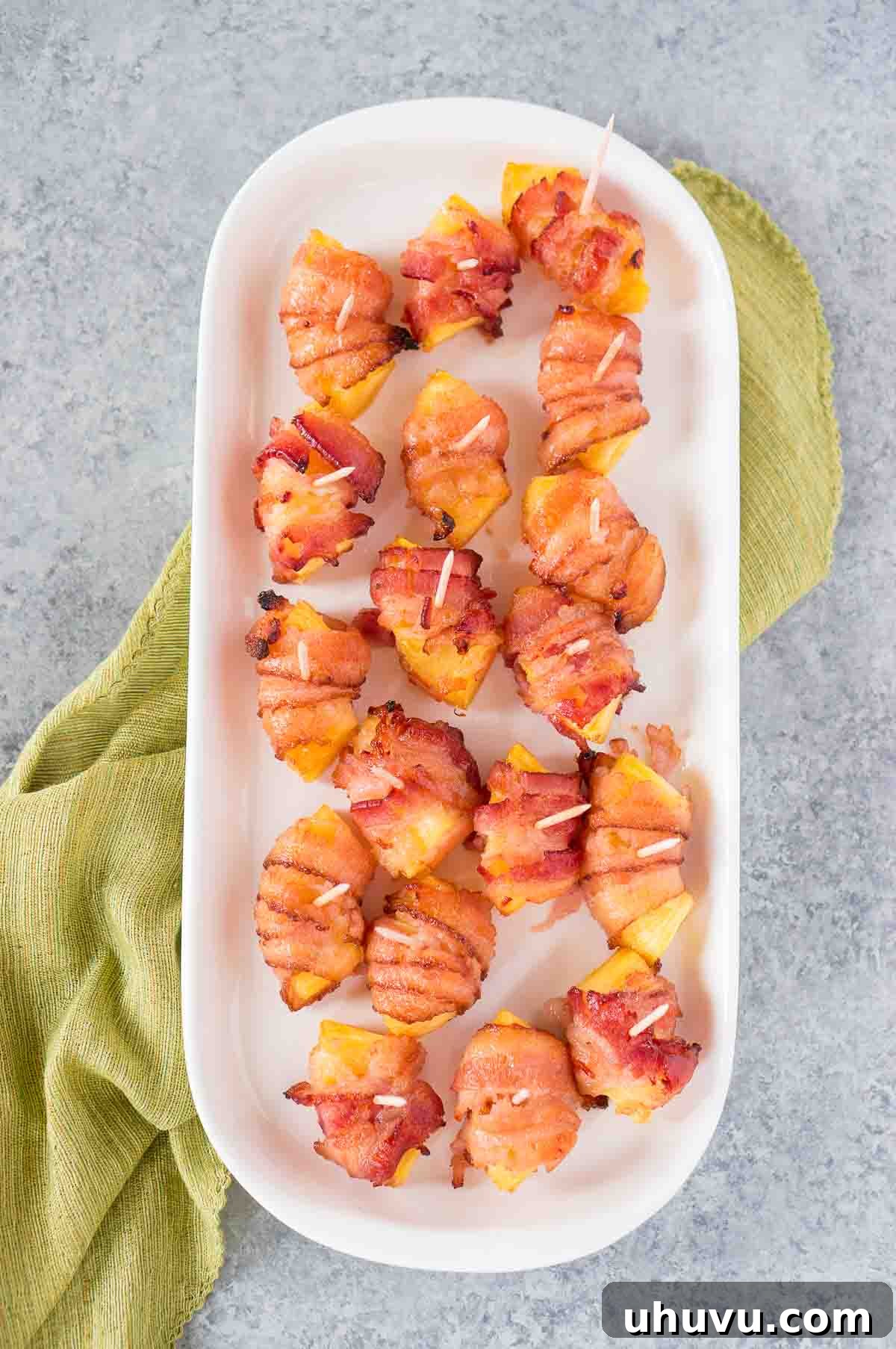 Sweet & Savory Bacon Pineapple Poppers 2 Delicious bacon wrapped pineapple bites for a holiday party appetizer