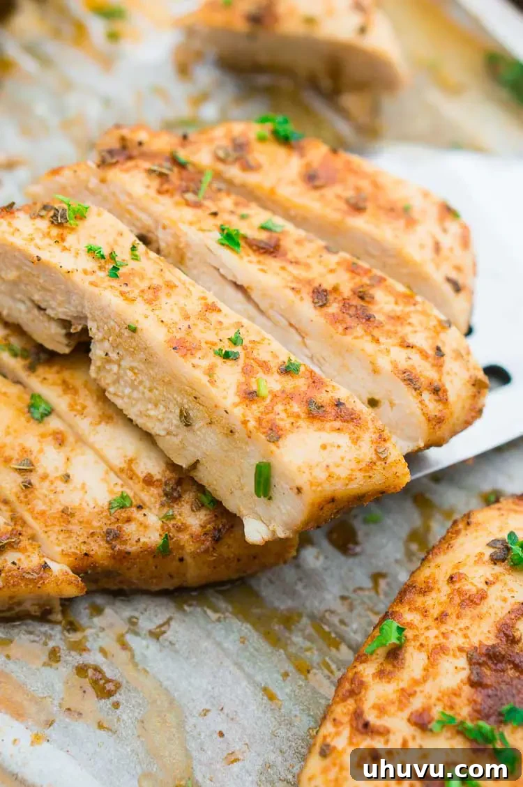 Roasted chicken breast sliced and served with fresh herbs
