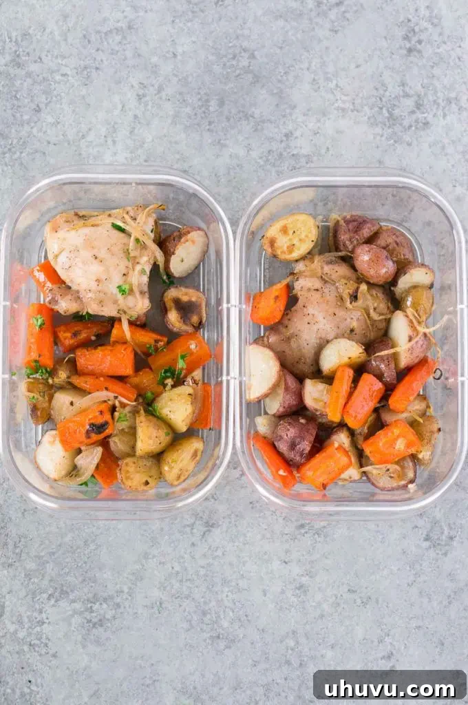 Individual meal prep containers filled with baked chicken and potatoes, ready for the week.