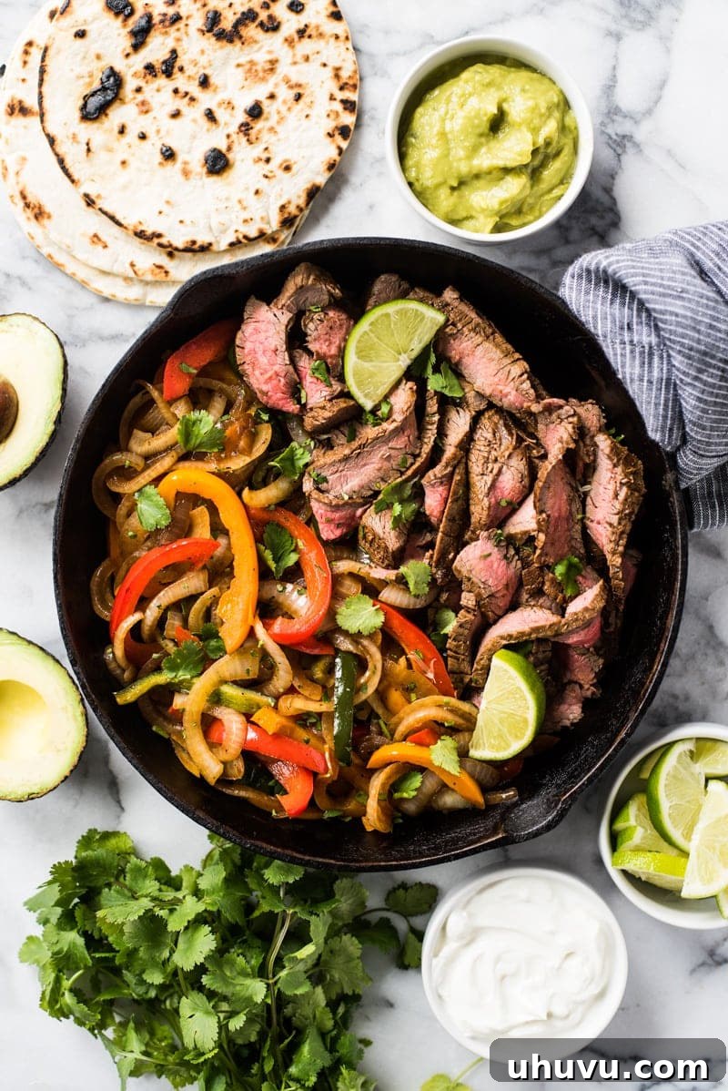Guilt-Free Mexican Favorites 3 Easy Steak Fajitas - Perfectly seasoned, juicy steak fajitas with colorful peppers and onions, a healthy Mexican meal.