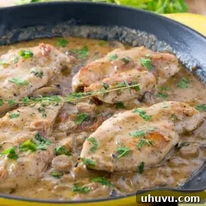 Luxurious Easy Creamy Chicken Marsala in a skillet, served with fresh herbs.