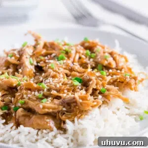 Tender Instant Pot Honey Sesame Chicken in a savory sauce, garnished with sesame seeds.
