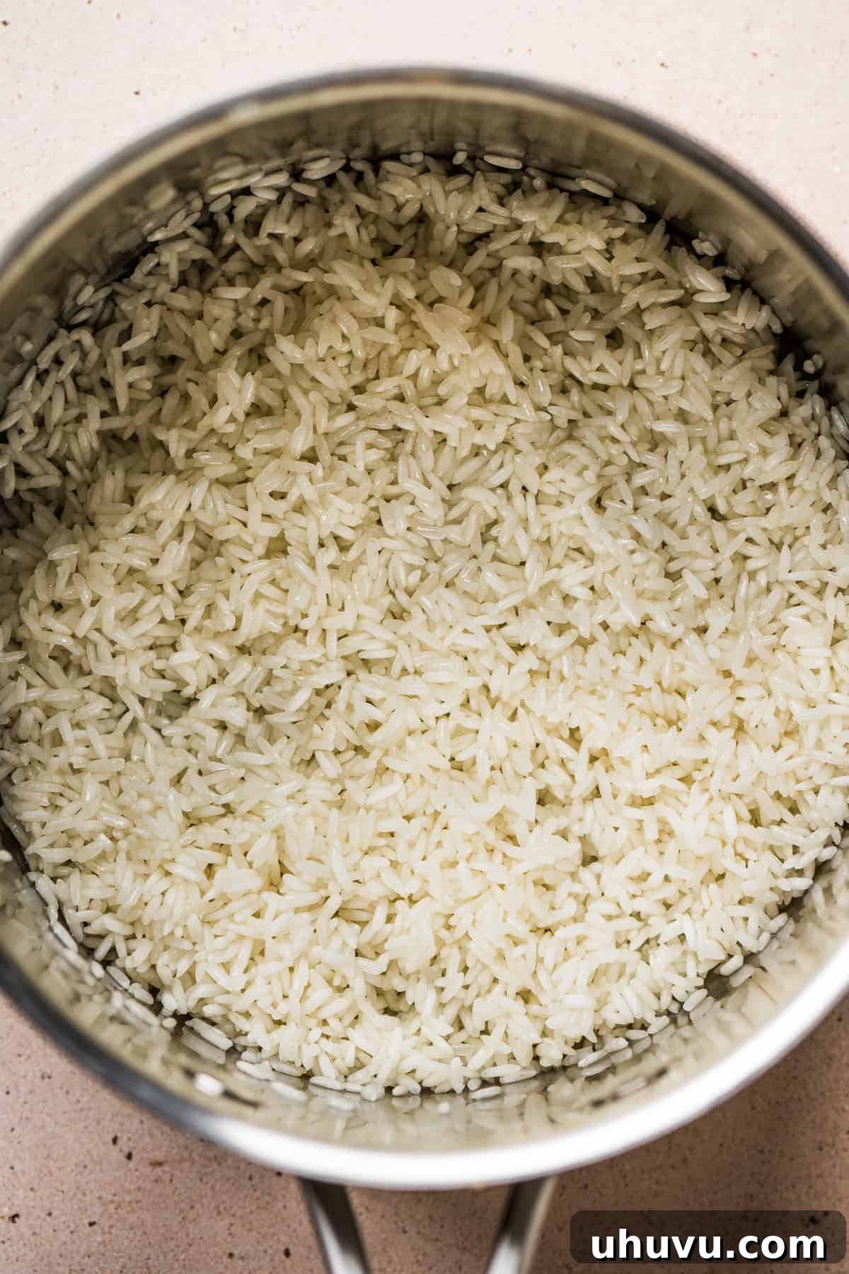 Cilantro Lime Rice Perfection 4 Rinsed rice being toasted in olive oil in a sauce pot.