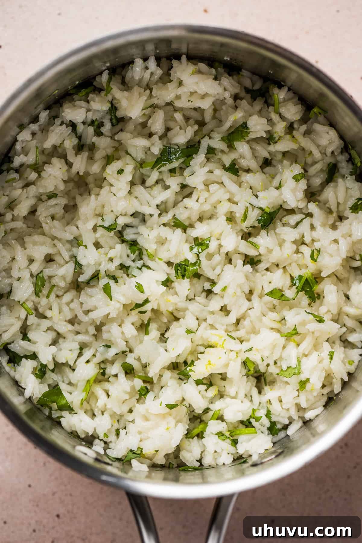 Cilantro Lime Rice Perfection 7 Fluffed and mixed cilantro lime rice in a pot, ready to serve.