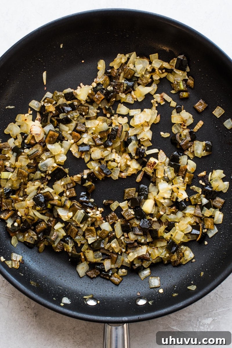 Effortless Taco Delight 3 Taco Casserole meat and veggie mixture cooking in a skillet.
