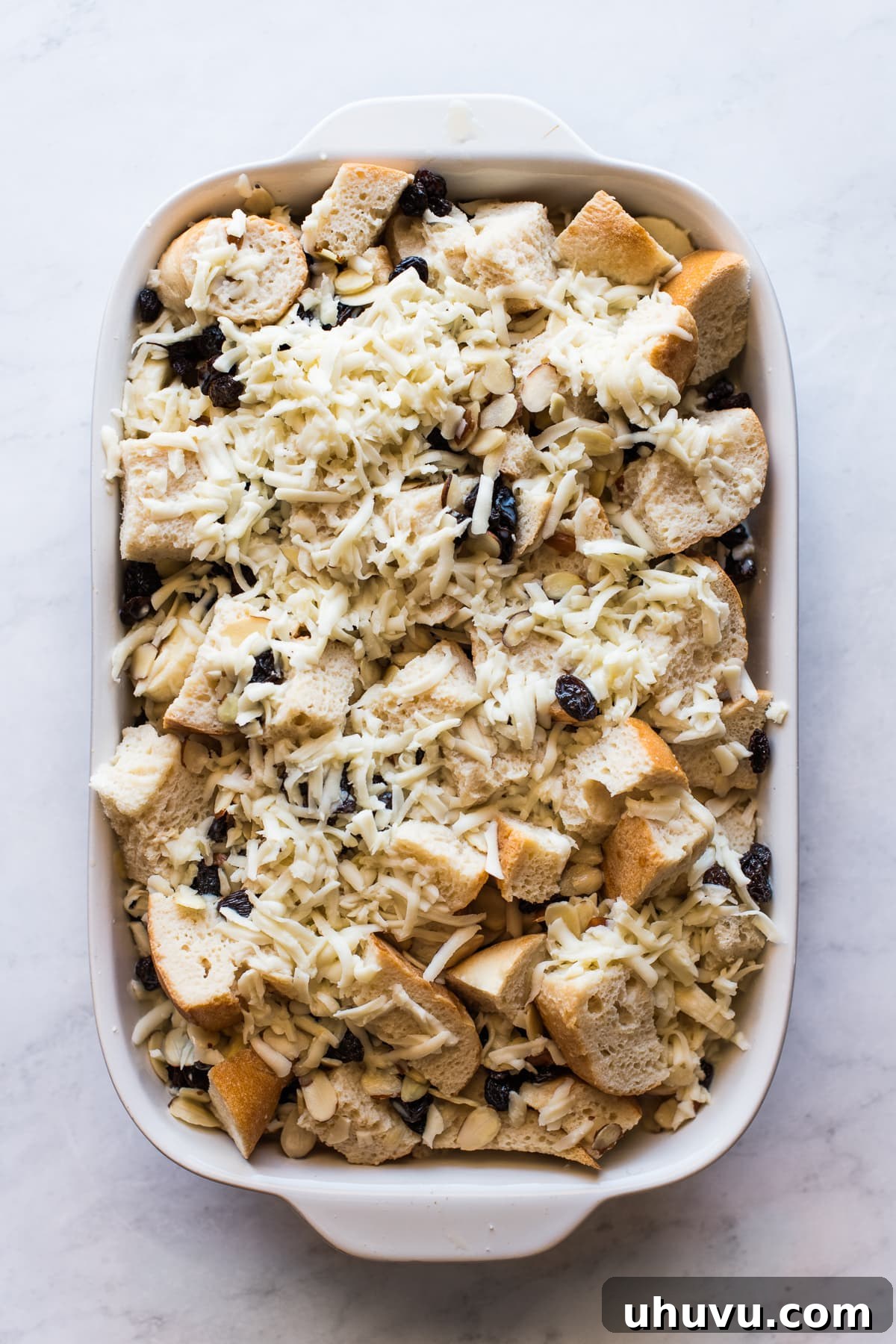 Capirotada: Mexico's Beloved Bread Pudding 4 Ingredients for capirotada recipe in a baking dish.