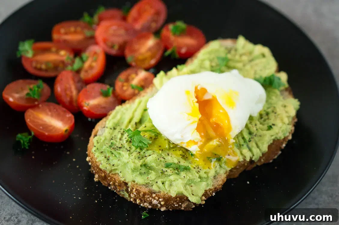 Two perfectly poached eggs, ready to be served