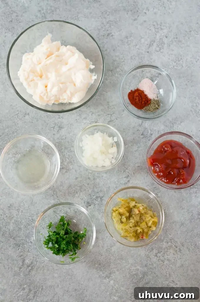 Fresh ingredients for homemade Thousand Island dressing including mayo, ketchup, relish, and herbs.
