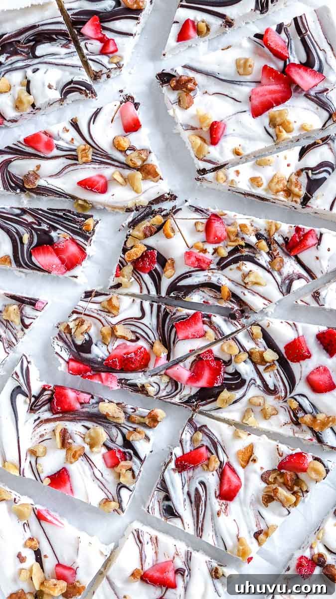Refreshing Strawberry Frozen Yogurt Bark 2 Low carb frozen yogurt bark with chocolate, strawberries, and walnuts, perfectly portioned for a healthy snack.