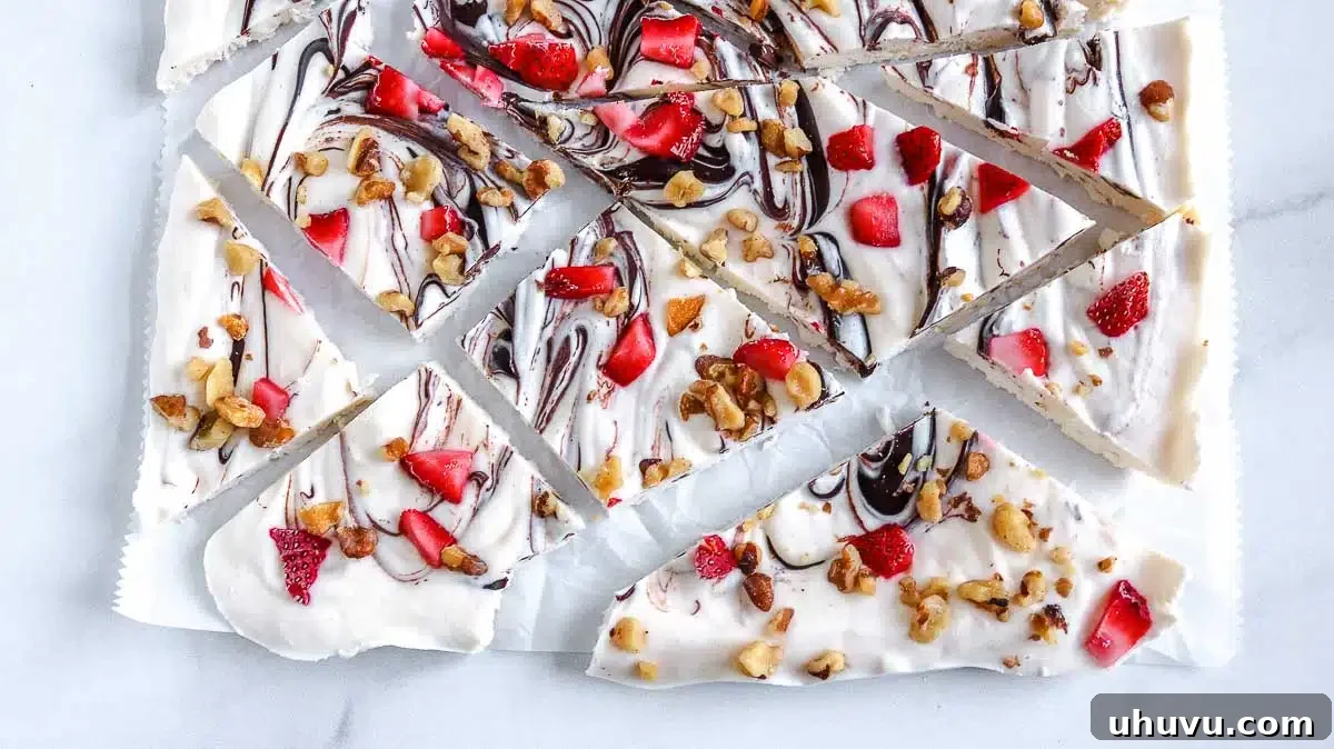 Refreshing Strawberry Frozen Yogurt Bark 3 Delicious keto frozen yogurt bark, garnished with vibrant strawberries and crunchy walnuts, ready to be frozen.